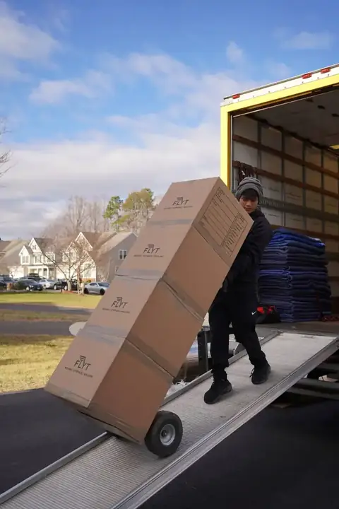 FLYT Moving crew loading a home in Historic Old Town Manassas, VA near the train depot